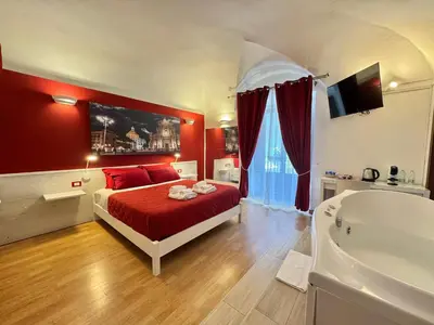 Letto o letti in una camera di CANTU' SUITE