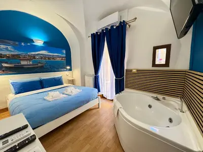 Letto o letti in una camera di CANTU' SUITE