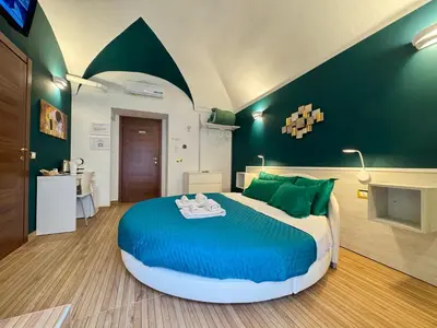 Letto o letti in una camera di CANTU' SUITE