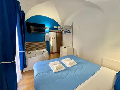 Letto o letti in una camera di CANTU' SUITE