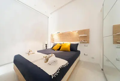 Letto o letti in una camera di Suite Bacco Ortigia