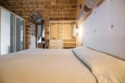 Letto o letti in una camera di Villa Il Carrubo val di noto con piscina privata