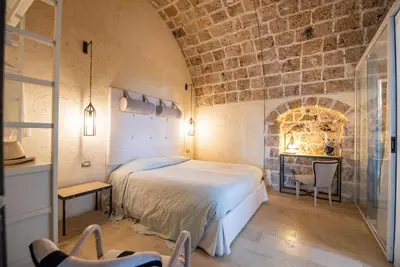 Letto o letti in una camera di Villa Il Carrubo val di noto con piscina privata