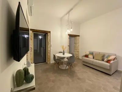 TV o dispositivi per l'intrattenimento presso Casa Maria ampio appartamento per famiglie vicino Ortigia