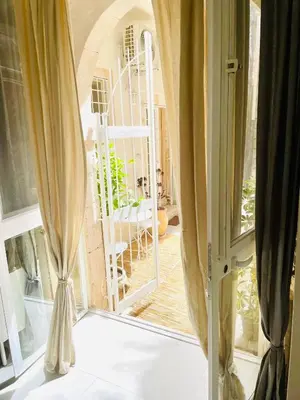 Letto o letti in una camera di LEMON SUITE Ortigia