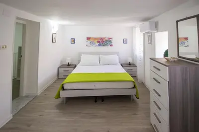 Letto o letti in una camera di Maniace Homes - Federico & Angelica by Ortigia Apartments