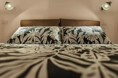 Letto o letti in una camera di San Berillo home
