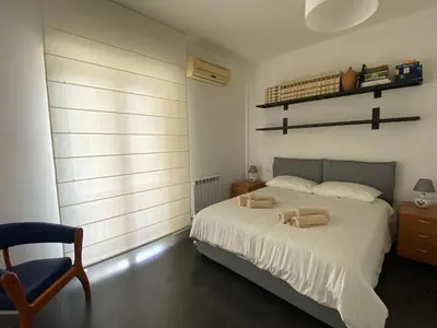 Letto o letti in una camera di Casa Genia a due passi dal Teatro Greco