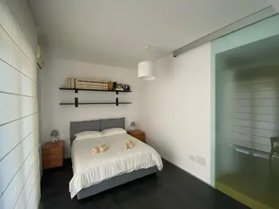 Letto o letti in una camera di Casa Genia a due passi dal Teatro Greco