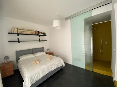 Letto o letti in una camera di Casa Genia a due passi dal Teatro Greco
