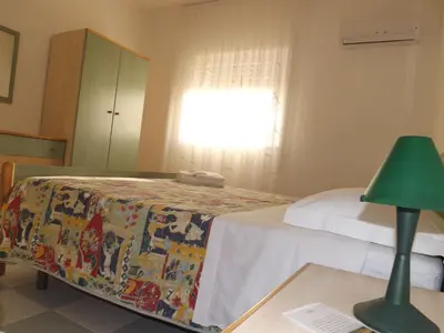 Letto o letti in una camera di Le Dune Residence