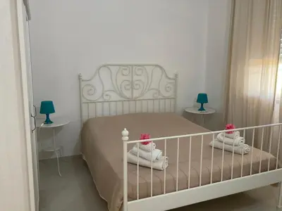 Letto o letti in una camera di Villa Diana