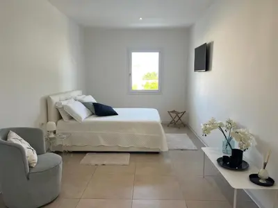 Letto o letti in una camera di Villa Flavia