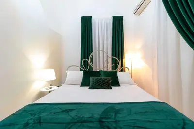 Letto o letti in una camera di Pupi e Pupari