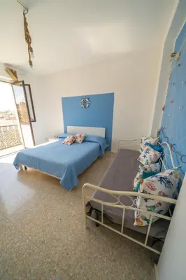 Letto o letti in una camera di VICOLO A MARE