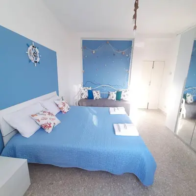Letto o letti in una camera di VICOLO A MARE