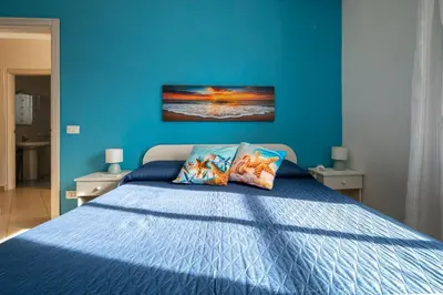 Letto o letti in una camera di Summer Beach Villa a 100mt dal mare Gallina