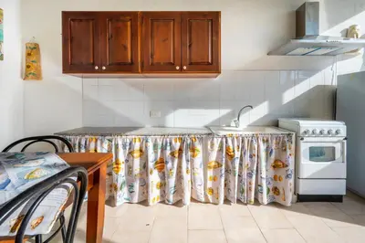 Cucina o angolo cottura di Summer Beach Villa a 100mt dal mare Gallina