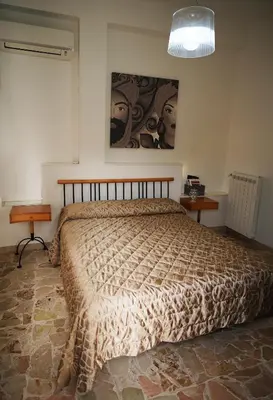 Letto o letti in una camera di Finestra sui Ponti