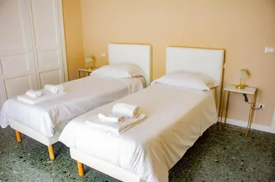 Letto o letti in una camera di Palazzo La Piana Rooms