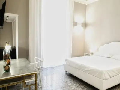 Letto o letti in una camera di Palazzo La Piana Rooms