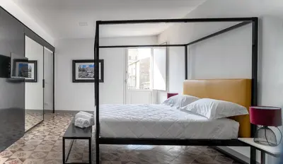 Letto o letti in una camera di MYMOON Val di Noto