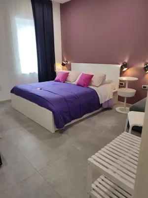 Letto o letti in una camera di B&B CaselloA Suites