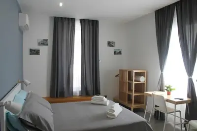 Letto o letti in una camera di B&B CaselloA Suites