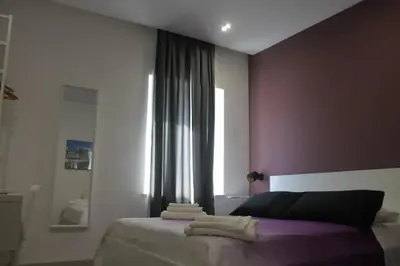 Letto o letti in una camera di B&B CaselloA Suites