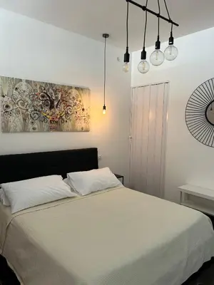 Letto o letti in una camera di Ortigia Loft Via Malta, 22