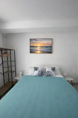 Letto o letti in una camera di La Battigia
