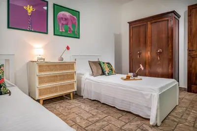 Letto o letti in una camera di Il Giardino Dei Limoni 8, Emma Villas