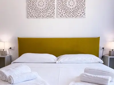 Letto o letti in una camera di Dimora Calauriia - Adults Only
