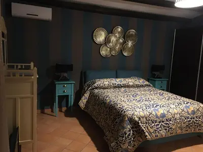 Letto o letti in una camera di La stanza delle Muse in Villa con Piscina