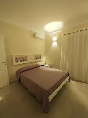 Letto o letti in una camera di San Domenico Casa Vacanze