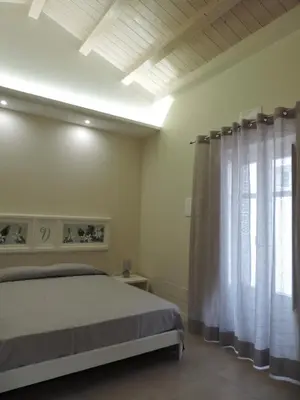 Letto o letti in una camera di San Domenico Casa Vacanze