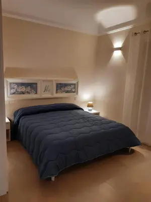 Letto o letti in una camera di San Domenico Casa Vacanze