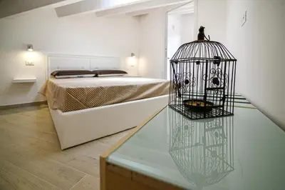 Letto o letti in una camera di Villa Laura Charme Apartments
