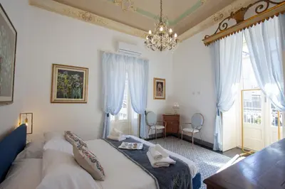 Letto o letti in una camera di Palazzo d'Autore - Luxury Home - Ragusa Centro