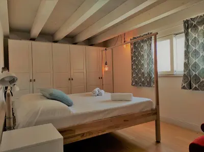 Letto o letti in una camera di Suite Bagnara- Ortigia Holidays