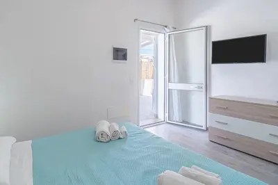 Letto o letti in una camera di Il Faraglione
