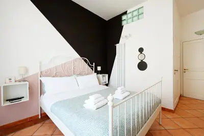 Letto o letti in una camera di Palazzo Currò