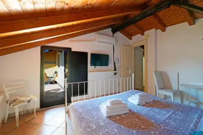 Letto o letti in una camera di Palazzo Currò