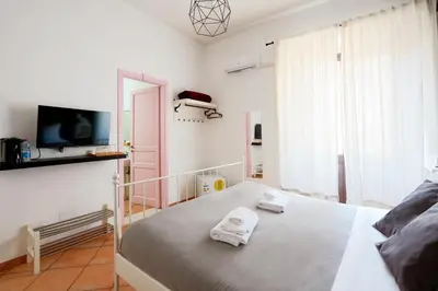 Letto o letti in una camera di Palazzo Currò