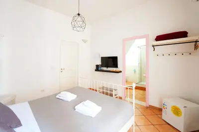 Letto o letti in una camera di Palazzo Currò