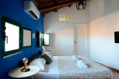 Letto o letti in una camera di Palazzo Currò