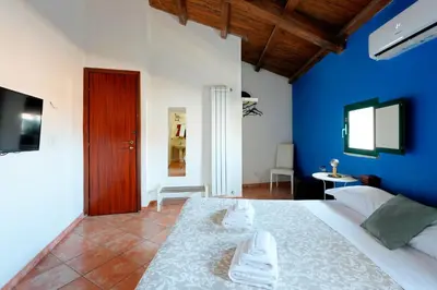 Letto o letti in una camera di Palazzo Currò