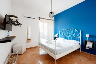 Letto o letti in una camera di Palazzo Currò