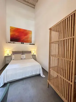 Letto o letti in una camera di AlbaRosa