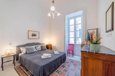 Letto o letti in una camera di GuestHost - Ortigia and Temple of Apollo Apartments